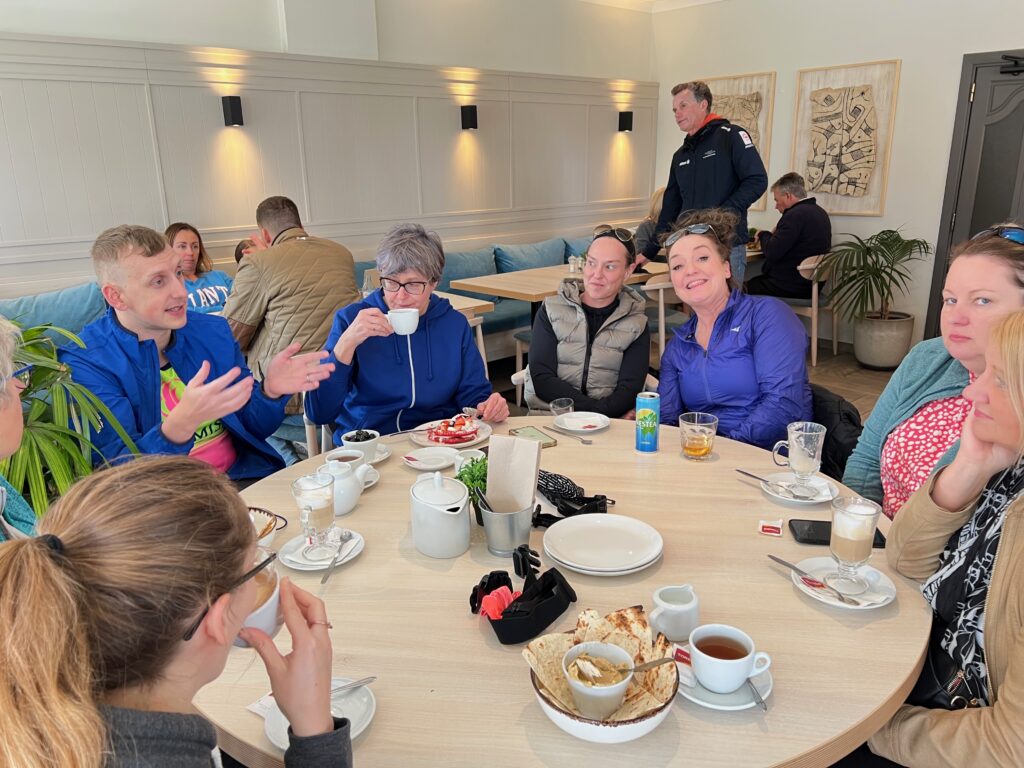 Athletes socialising at a coffee shop in Vilamoura between training sessions