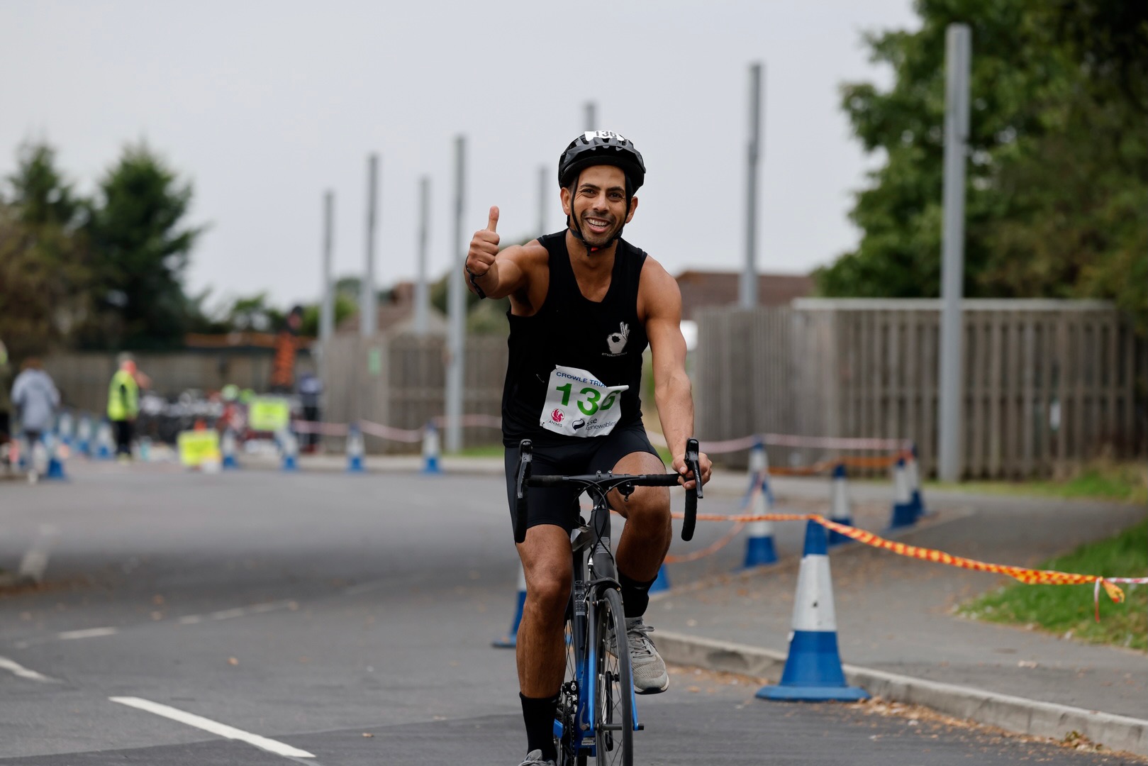 A triathlete giving a thumbs up on the bike course at Crowle Triathlon