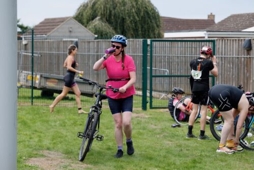 Athletes in transition at Crowle Triathlon with ordinary bikes and kit